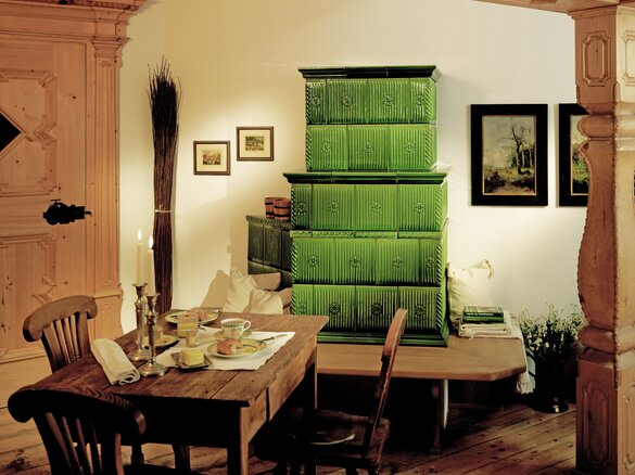 Tiled stove with tile Pfeifenmuster in ofengruen | © Sommerhuber GmbH